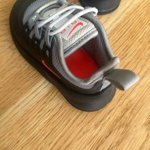 Nike Kids Black and Gray Sneakers with Red Accents